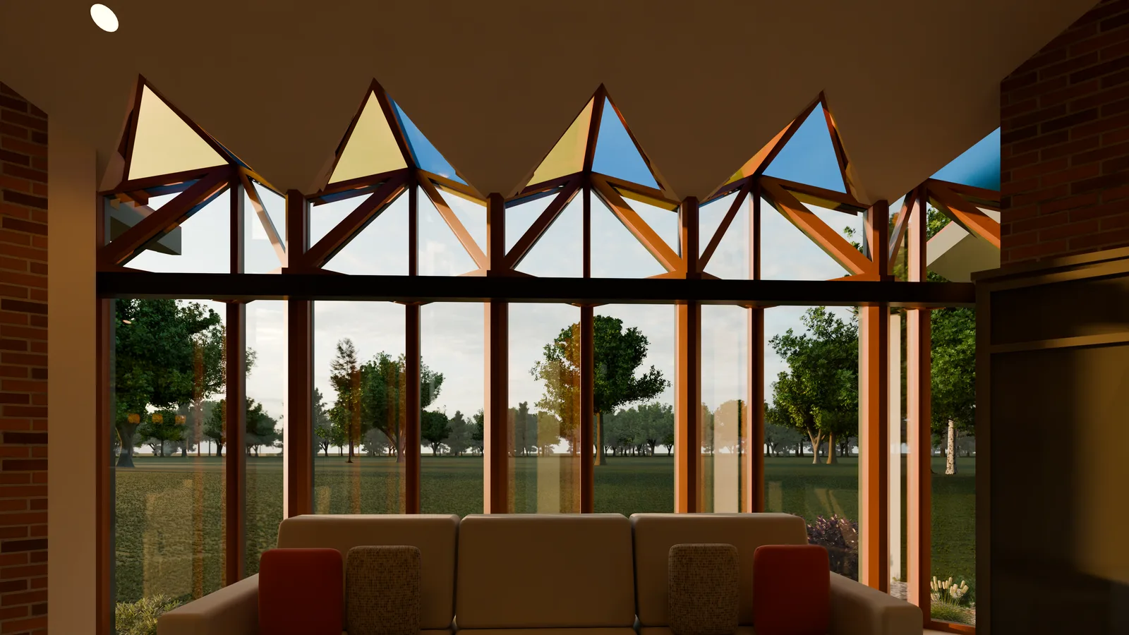 The living room's sawtooth glass in golden hour light